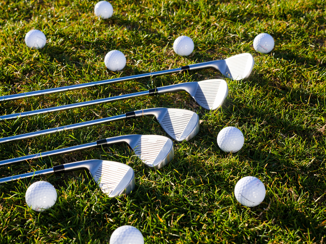 Five Golf Clubs and Golf Balls